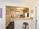 Bright kitchen with white cabinets, butcher block countertops, and a breakfast bar at 557 Wakefield Dr # A, Charlotte, NC 28209