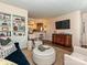 Inviting living room featuring open access to kitchen, built-in shelving and hardwood flooring at 557 Wakefield Dr # A, Charlotte, NC 28209