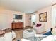 Cozy living room featuring a TV, hardwood floors, and plenty of natural light at 557 Wakefield Dr # A, Charlotte, NC 28209