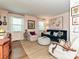 Comfortable living room featuring hardwood floors, art, and large windows for natural light at 557 Wakefield Dr # A, Charlotte, NC 28209