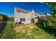 Well-maintained backyard with a trampoline and a black metal fence at 5716 Langwell Ln, Charlotte, NC 28278