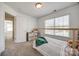 A bedroom featuring a cozy carpet, ample natural light, and neutral decor at 5716 Langwell Ln, Charlotte, NC 28278