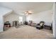A spacious bonus room featuring a ceiling fan and neutral decor at 5716 Langwell Ln, Charlotte, NC 28278