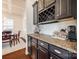 A butler's pantry or coffee bar sits between the kitchen and the dining area at 5716 Langwell Ln, Charlotte, NC 28278