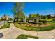 Community entrance featuring lush landscaping and a welcoming sign under a clear blue sky at 5716 Langwell Ln, Charlotte, NC 28278