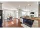 The kitchen overlooks the breakfast nook and the living room, and it is equiped with stainless steel appliances at 5716 Langwell Ln, Charlotte, NC 28278