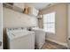 Practical laundry room with a front-load washer and dryer set at 5716 Langwell Ln, Charlotte, NC 28278