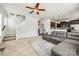 The open concept living room showcases the kitchen and stairs to the second level at 5716 Langwell Ln, Charlotte, NC 28278