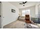 Cozy home office with a comfortable couch and a desk setup for remote work at 5716 Langwell Ln, Charlotte, NC 28278