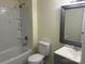 Clean bathroom features a tub with shower, white fixtures, and a framed mirror over the sink at 59 Pine St, Great Falls, SC 29055