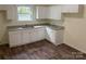Updated kitchen featuring new cabinets and granite countertops at 59 Pine St, Great Falls, SC 29055