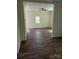 Bright living room with hard wood floors and ceiling fan at 59 Pine St, Great Falls, SC 29055