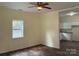 Bright living room with hardwood floors and a ceiling fan at 59 Pine St, Great Falls, SC 29055