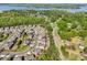 A vibrant neighborhood surrounded by lush greenery and mature trees near a tranquil lake at 620 Millstream Dr, Rock Hill, SC 29732
