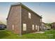 Exterior shot of a brick home with a well-maintained backyard at 620 Millstream Dr, Rock Hill, SC 29732