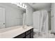Modern bathroom featuring a dark wood vanity and a shower with a white shower curtain at 620 Millstream Dr, Rock Hill, SC 29732