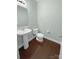 Powder room with pedestal sink, toilet, and neutral paint at 620 Millstream Dr, Rock Hill, SC 29732
