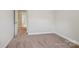 Bedroom featuring neutral walls and plush carpeting with a door leading to the adjacent bathroom at 620 Millstream Dr, Rock Hill, SC 29732