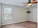 Bedroom featuring natural light from a window, including a ceiling fan and TV mount at 620 Millstream Dr, Rock Hill, SC 29732