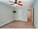 Bedroom showcasing neutral walls and carpet, including a door frame and a TV mount at 620 Millstream Dr, Rock Hill, SC 29732