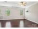 Large, well-lit bedroom with hard wood floors and ceiling fan at 620 Millstream Dr, Rock Hill, SC 29732
