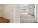 Showing a walk-in closet with shelves and neutral carpet, as well as the interior of the bedroom at 620 Millstream Dr, Rock Hill, SC 29732