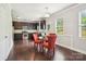 Eat-in kitchen featuring dark wood floors, stainless appliances, and a bright window at 620 Millstream Dr, Rock Hill, SC 29732