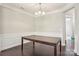 Elegant dining room featuring a large wooden table, wainscotting, and hardwood flooring, perfect for gatherings at 620 Millstream Dr, Rock Hill, SC 29732