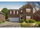 Beautiful two-story brick home with a two-car garage and manicured lawn at 620 Millstream Dr, Rock Hill, SC 29732