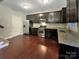 Well-equipped kitchen featuring stainless steel appliances, granite countertops, and ample cabinet space at 620 Millstream Dr, Rock Hill, SC 29732