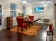 Cozy open living space featuring hardwood floors, a dining table, modern lighting, and comfortable seating at 620 Millstream Dr, Rock Hill, SC 29732