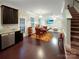 Open-concept living area with dining table, stainless appliances, hardwood floors, and a seamless flow for entertaining at 620 Millstream Dr, Rock Hill, SC 29732