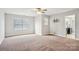 Spacious main bedroom featuring a ceiling fan, neutral walls, and a doorway to the ensuite bathroom at 620 Millstream Dr, Rock Hill, SC 29732