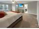 Spacious main bedroom features a comfy king bed, large windows, ceiling fan, and en-suite bathroom for ultimate relaxation at 620 Millstream Dr, Rock Hill, SC 29732