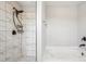 Clean shower and tub area featuring white marble tile and matte black fixtures, adding a touch of elegance at 620 Millstream Dr, Rock Hill, SC 29732