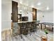 Basement bar area with stone accents, pendant lighting, and seating for entertaining at 633 Elmhurst Dr, Fort Mill, SC 29715
