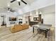 Spacious basement with a fireplace, bar area, and a ping pong table for recreation and relaxation at 633 Elmhurst Dr, Fort Mill, SC 29715