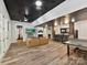 Finished basement with a wet bar, lounge area with TV, and walkout access at 633 Elmhurst Dr, Fort Mill, SC 29715