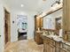 This bathroom features a double vanity, decorative tile floors, and access to main bedroom at 633 Elmhurst Dr, Fort Mill, SC 29715
