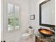 Chic powder room with a unique vessel sink, granite countertop, and a modern window at 633 Elmhurst Dr, Fort Mill, SC 29715