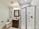 Bathroom featuring a vanity with a sink, a mirror, a toilet, and a glass shower stall at 633 Elmhurst Dr, Fort Mill, SC 29715