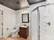 Well-lit bathroom with a walk-in shower, single sink vanity, toilet, and dark accents at 633 Elmhurst Dr, Fort Mill, SC 29715