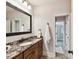 Bathroom featuring granite counters, wood cabinets, and access to additional bath areas at 633 Elmhurst Dr, Fort Mill, SC 29715