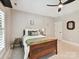 Cozy bedroom featuring a wooden bed frame, ceiling fan, and neutral color palette at 633 Elmhurst Dr, Fort Mill, SC 29715