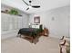 Cozy bedroom featuring a ceiling fan, plantation shutters, and neutral decor at 633 Elmhurst Dr, Fort Mill, SC 29715