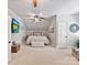 Attic bedroom with sloped ceilings, ceiling fan, neutral colors, and lots of natural light at 633 Elmhurst Dr, Fort Mill, SC 29715