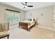 This bedroom offers a window with wood shutters, neutral paint, and ceiling fan at 633 Elmhurst Dr, Fort Mill, SC 29715
