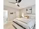 This bedroom boasts a ceiling fan, a neutral color scheme, and an ensuite bathroom at 633 Elmhurst Dr, Fort Mill, SC 29715