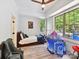 Bright bedroom with large windows, bed, ceiling fan, tent, and a cozy chair at 633 Elmhurst Dr, Fort Mill, SC 29715