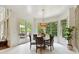 Bright breakfast nook with large windows, a round table, and access to the outdoor deck at 633 Elmhurst Dr, Fort Mill, SC 29715